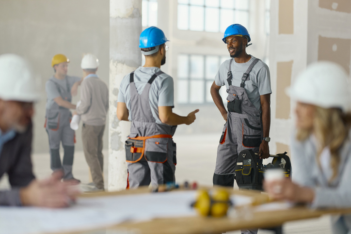 Workers in hard hats at construction site