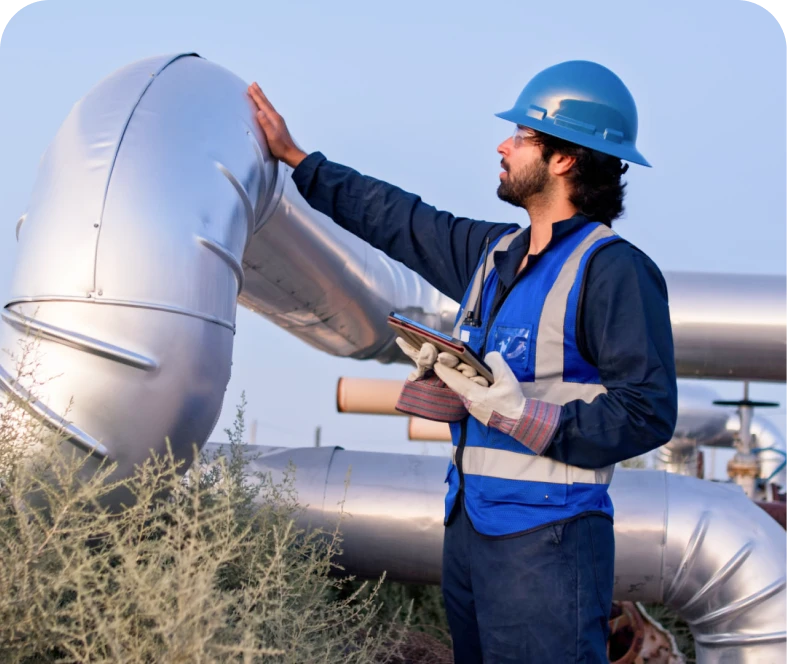 Industrial engineer examines metal pipeline