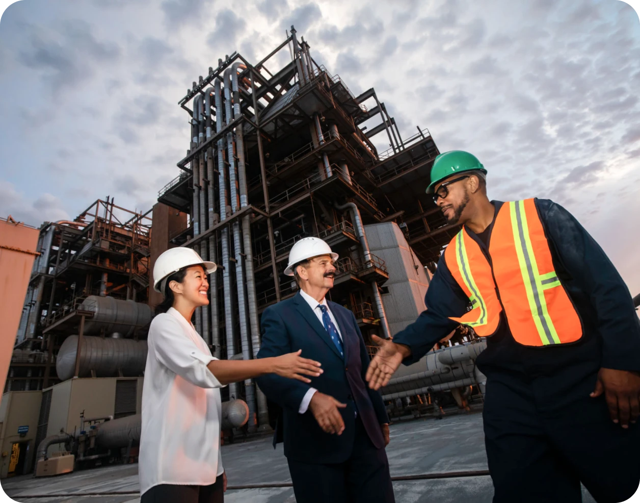 Professionals in hardhats at factory