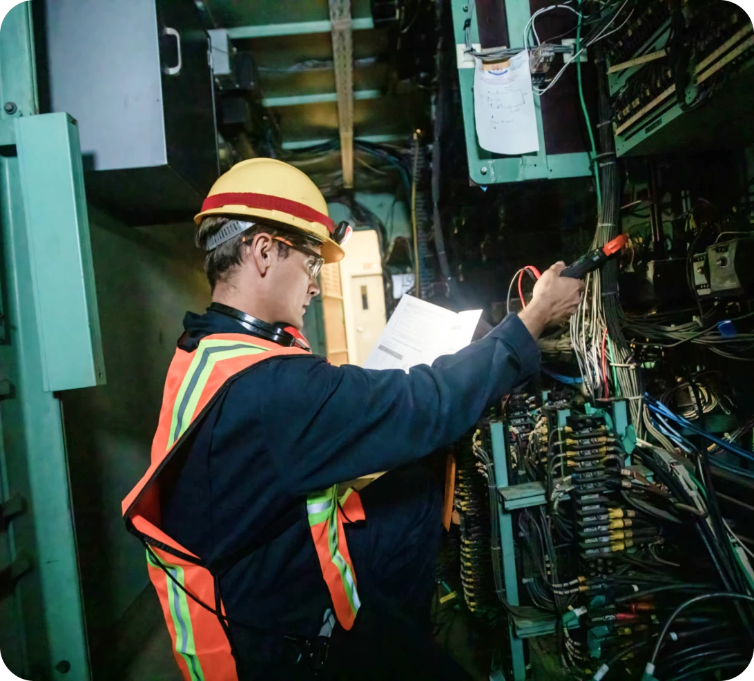 Technician working on control panel